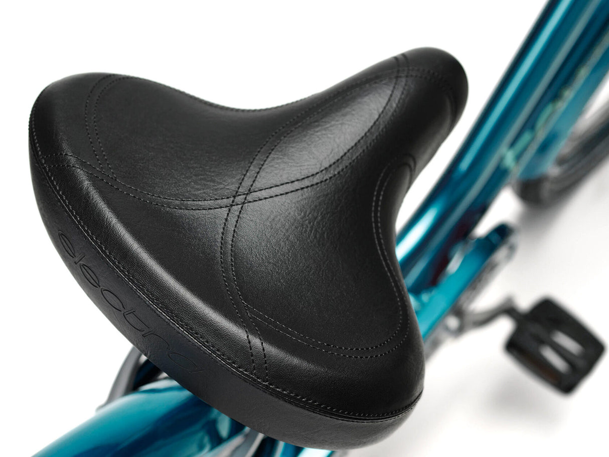 Close-up of a black bicycle seat on a blue bike frame.