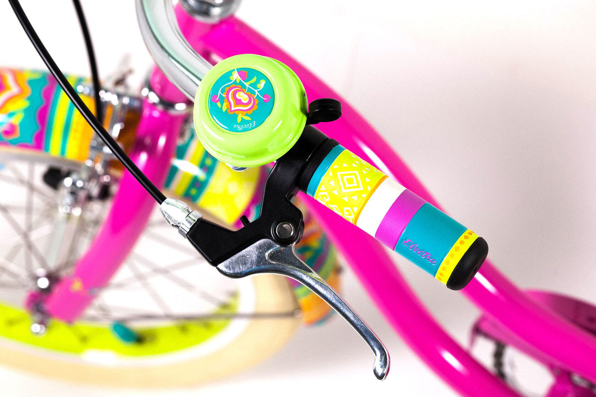 Close-up of a bicycle handlebar with colorful grips and bell on a blurred background