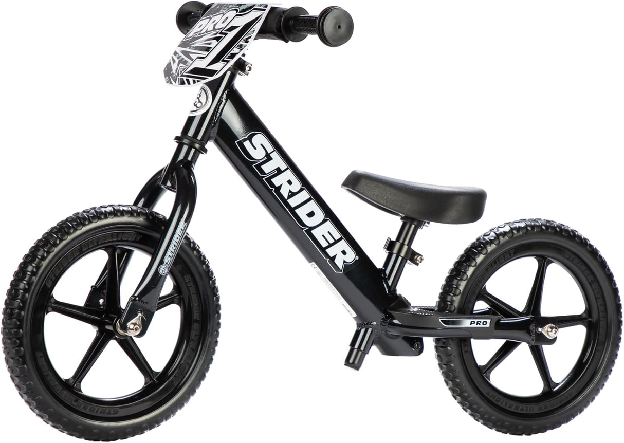 Black Strider balance bike on a white background