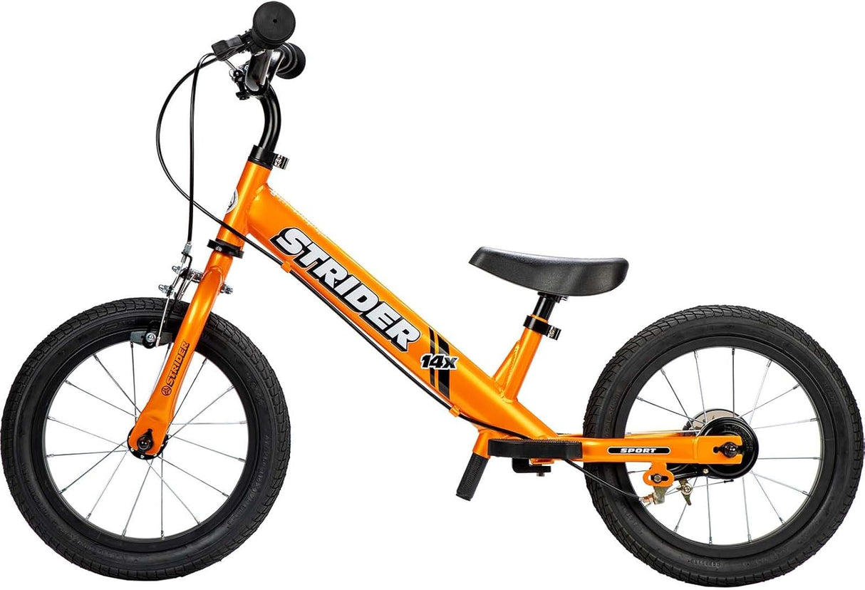 Orange Strider balance bike on a white background