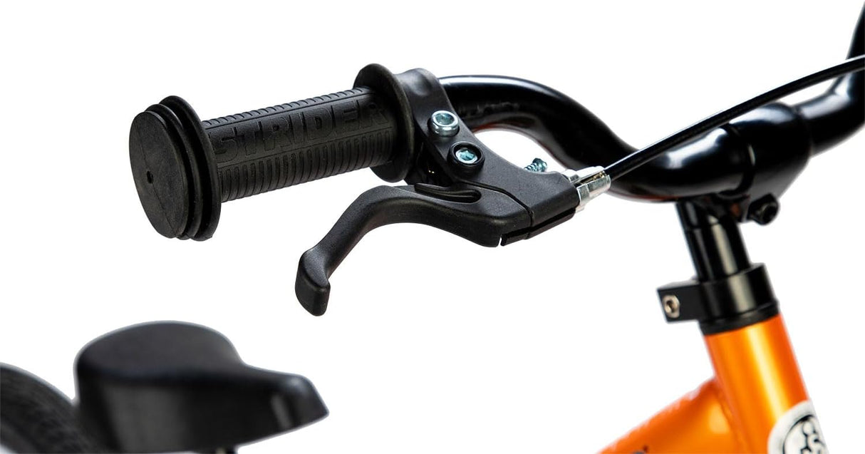 Close-up of a bicycle handlebar with black grips and brake lever on an orange frame.
