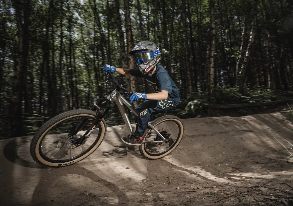 Child on a mountain bike in a forest setting