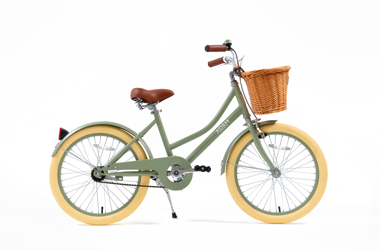 Green bicycle with a brown basket on a white background