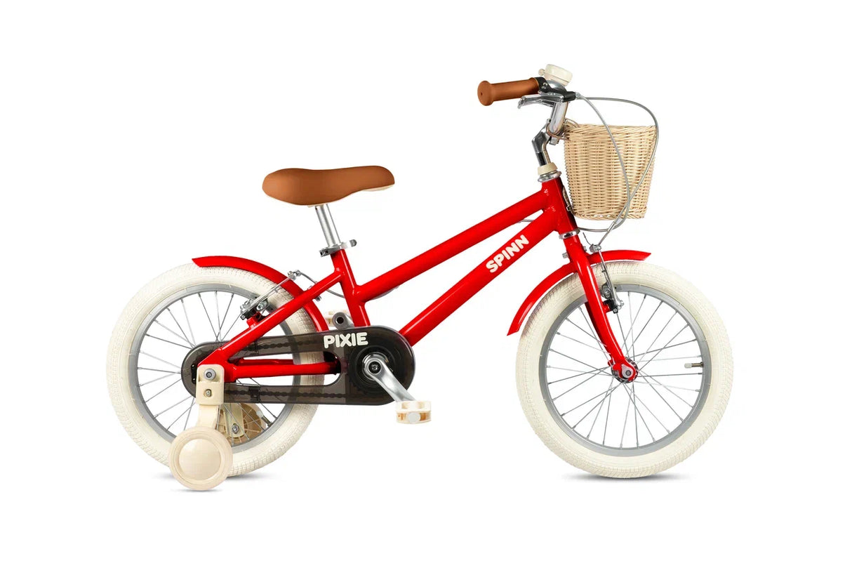 Red children's bicycle with a basket on a white background