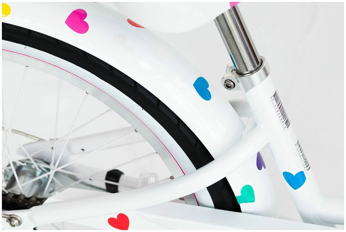 White bicycle with colorful heart designs on a white background