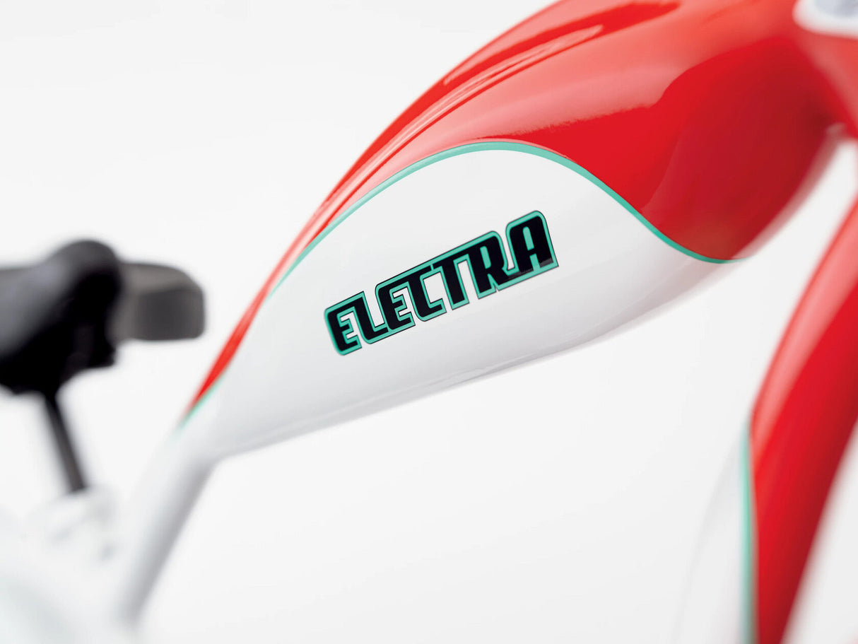 Close-up of a red and white bicycle with 'Electra' branding on a white background