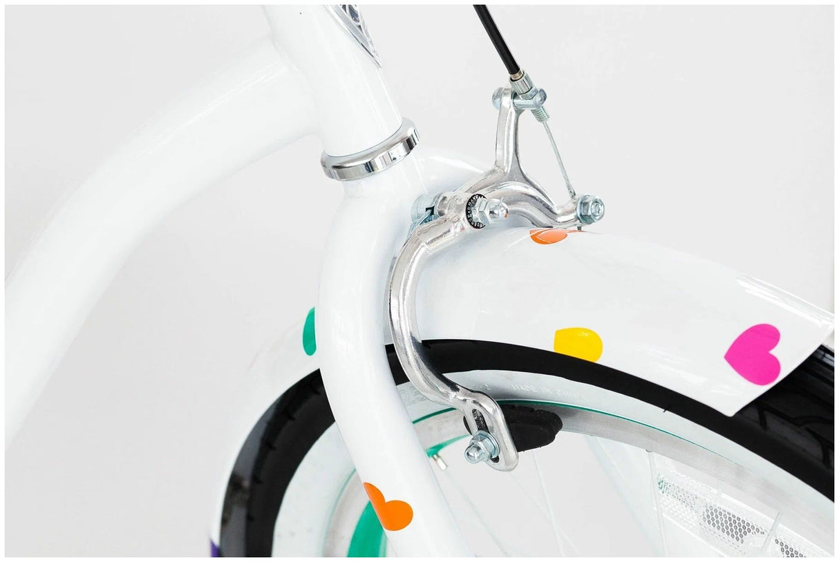 Close-up of a bicycle wheel with colorful heart-shaped stickers on a white background