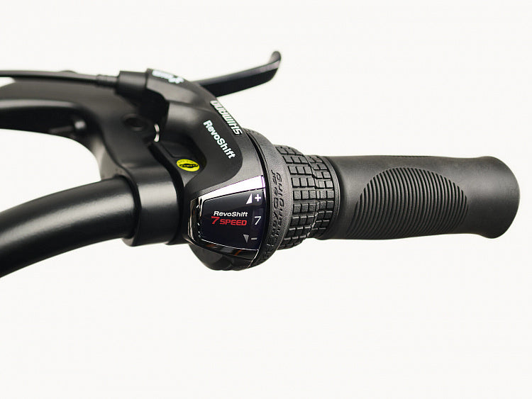 Close-up of a bicycle handlebar with a gear shifter on a white background