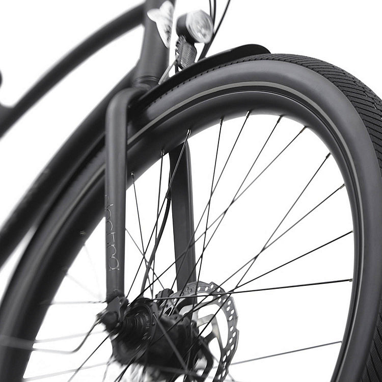 Close-up of a bicycle wheel with disc brake system on a white background