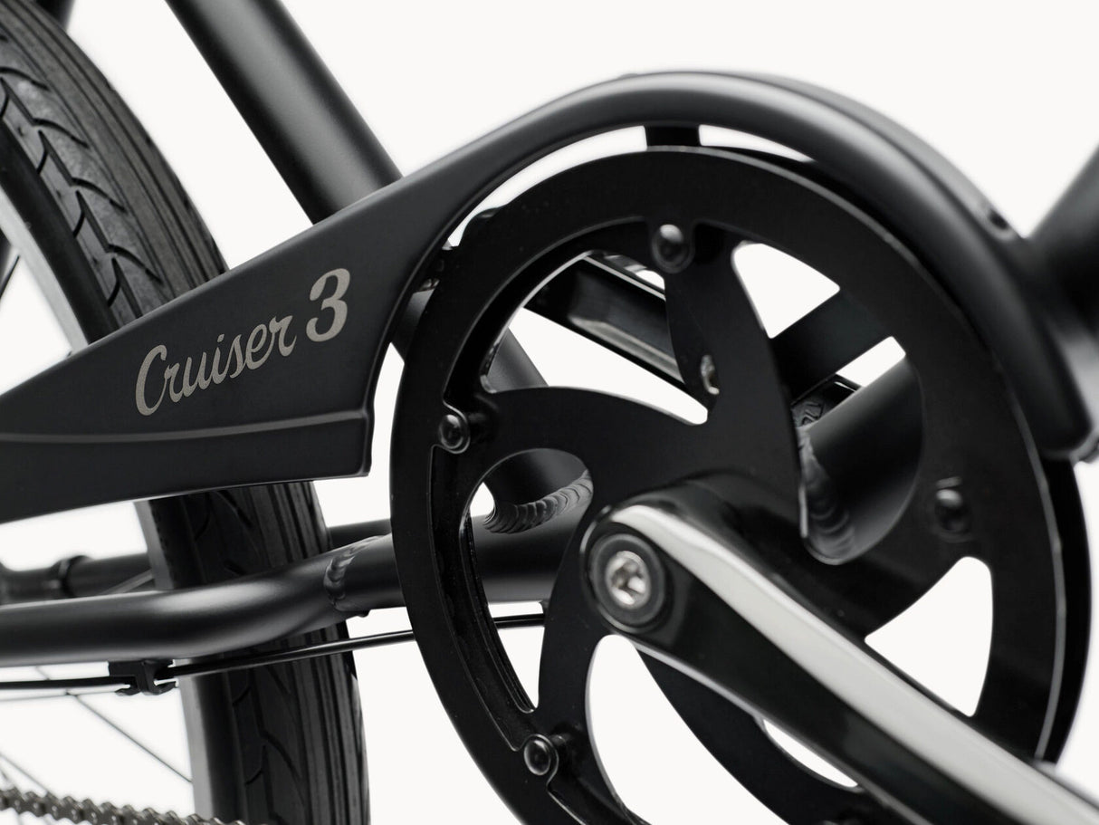 Close-up of a bicycle wheel with 'Cruiser 3' branding on a white background