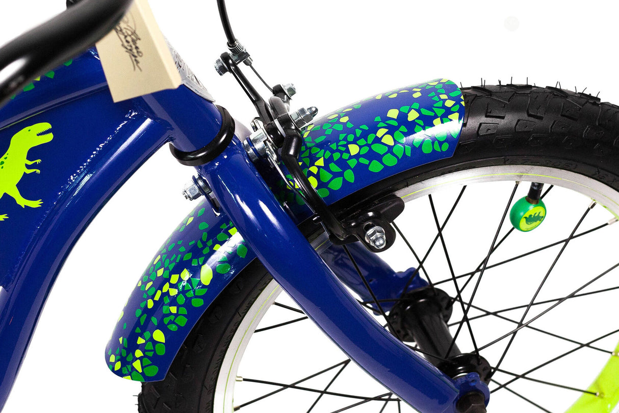 Close-up of a blue children's bike with green dinosaur graphics on a white background