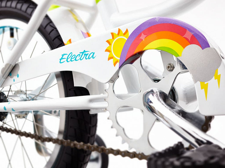 Close-up of a bicycle chain and gear system with a colorful Electra decal.