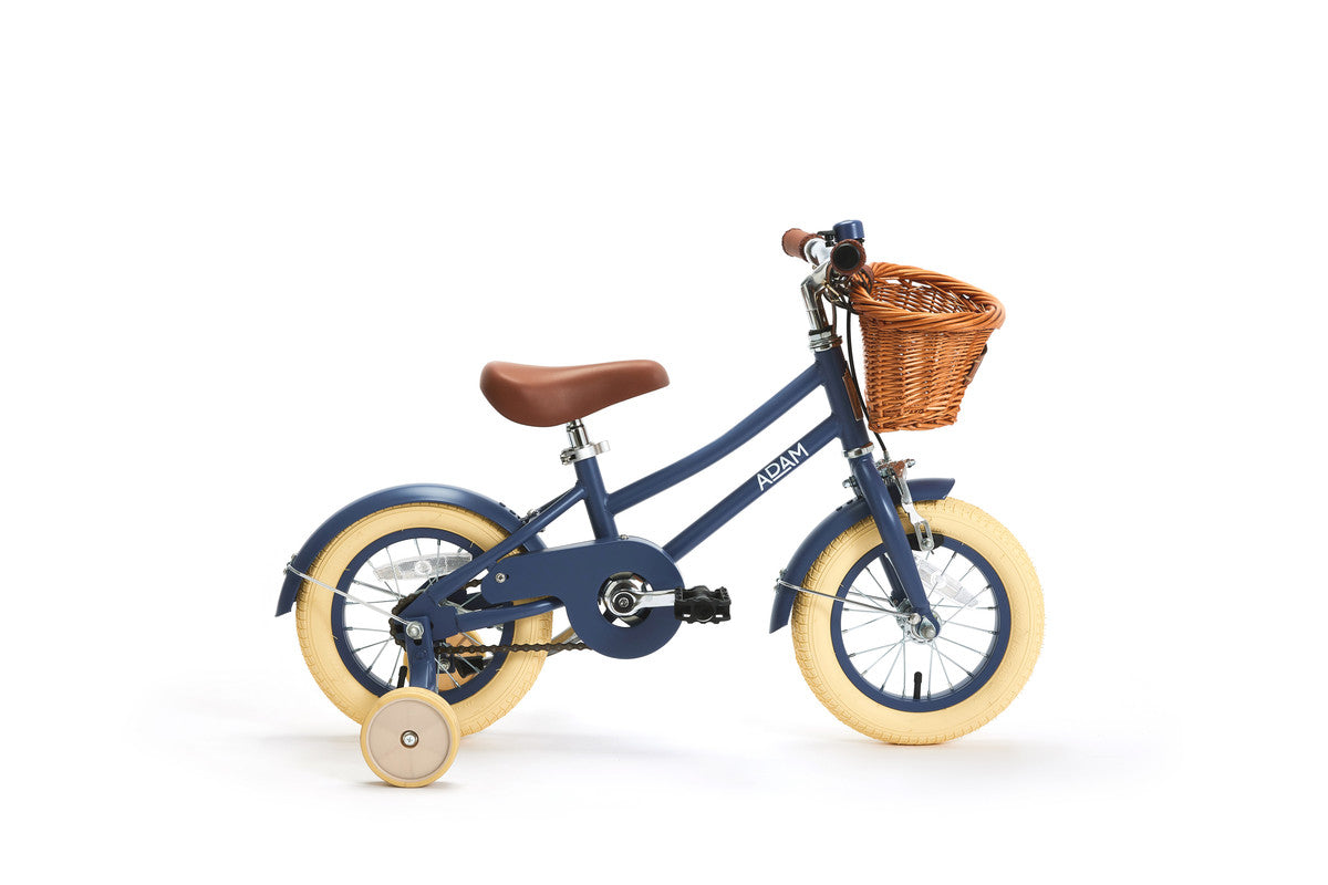 Children's bicycle with a basket on a white background