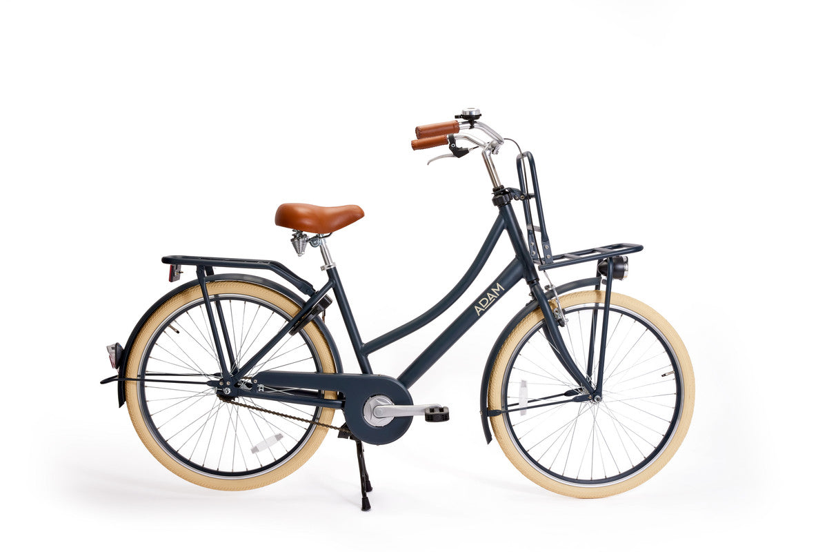 Navy blue bicycle with brown seat and tires on a white background