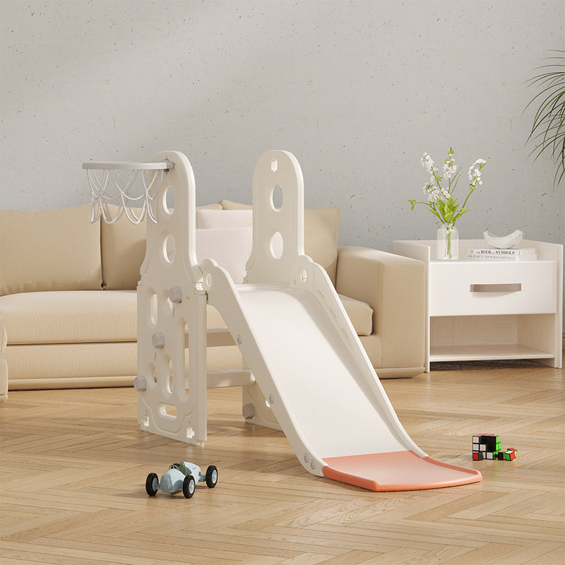 Children's slide with basketball hoop in a living room setting
