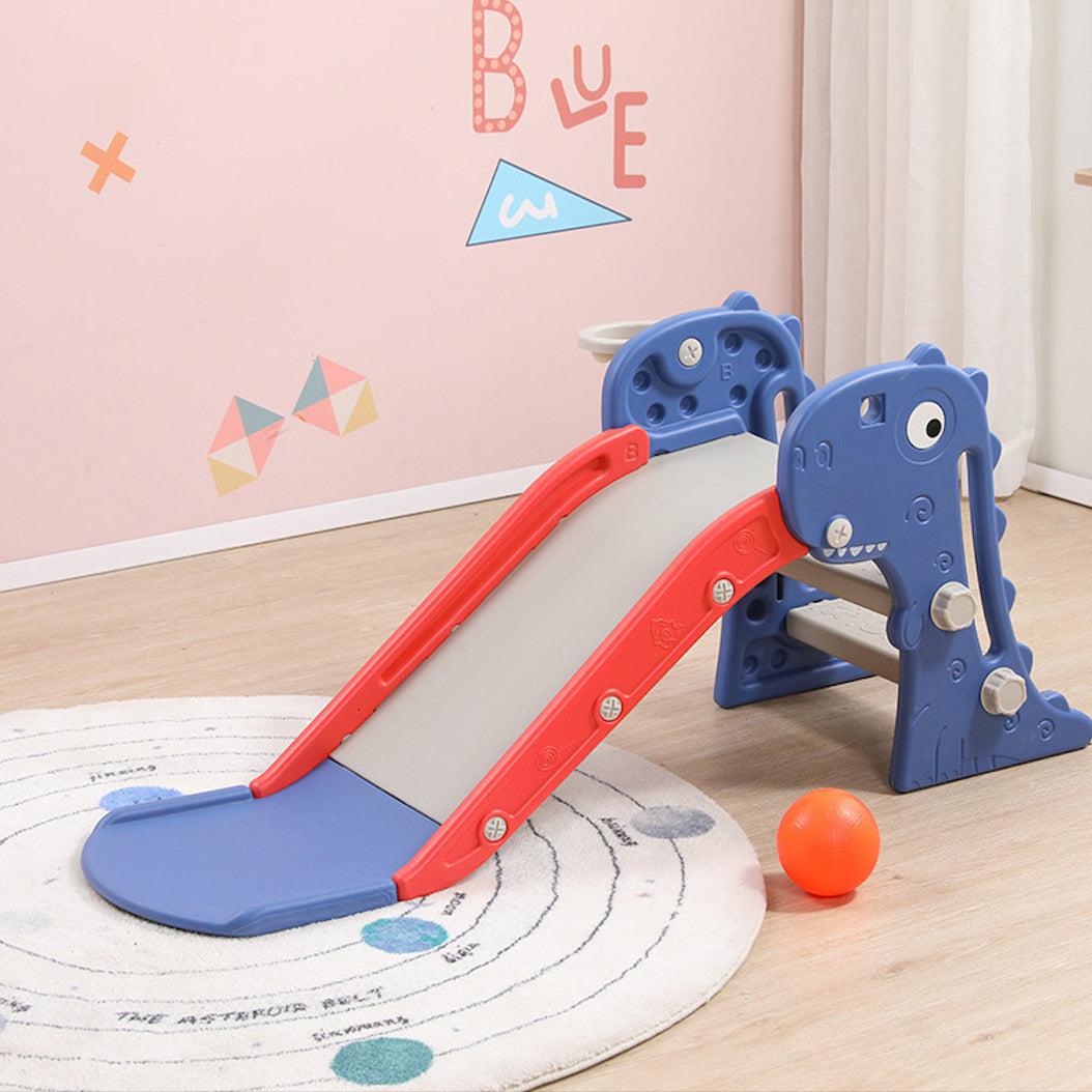 Children's slide with blue and red design on a wooden floor.