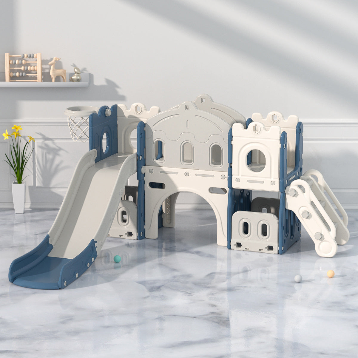 Children's playset with slides and climbing structures on a marble floor.