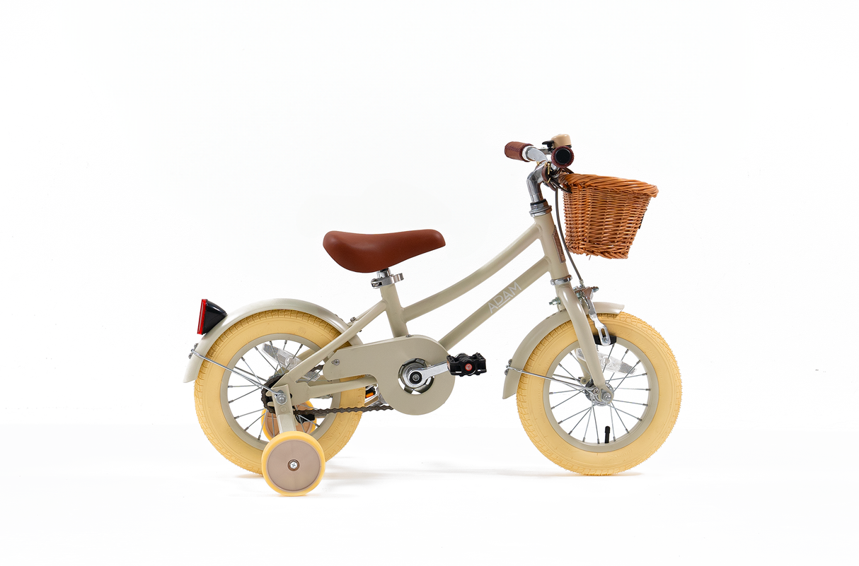 Children's bicycle with a basket on a white background