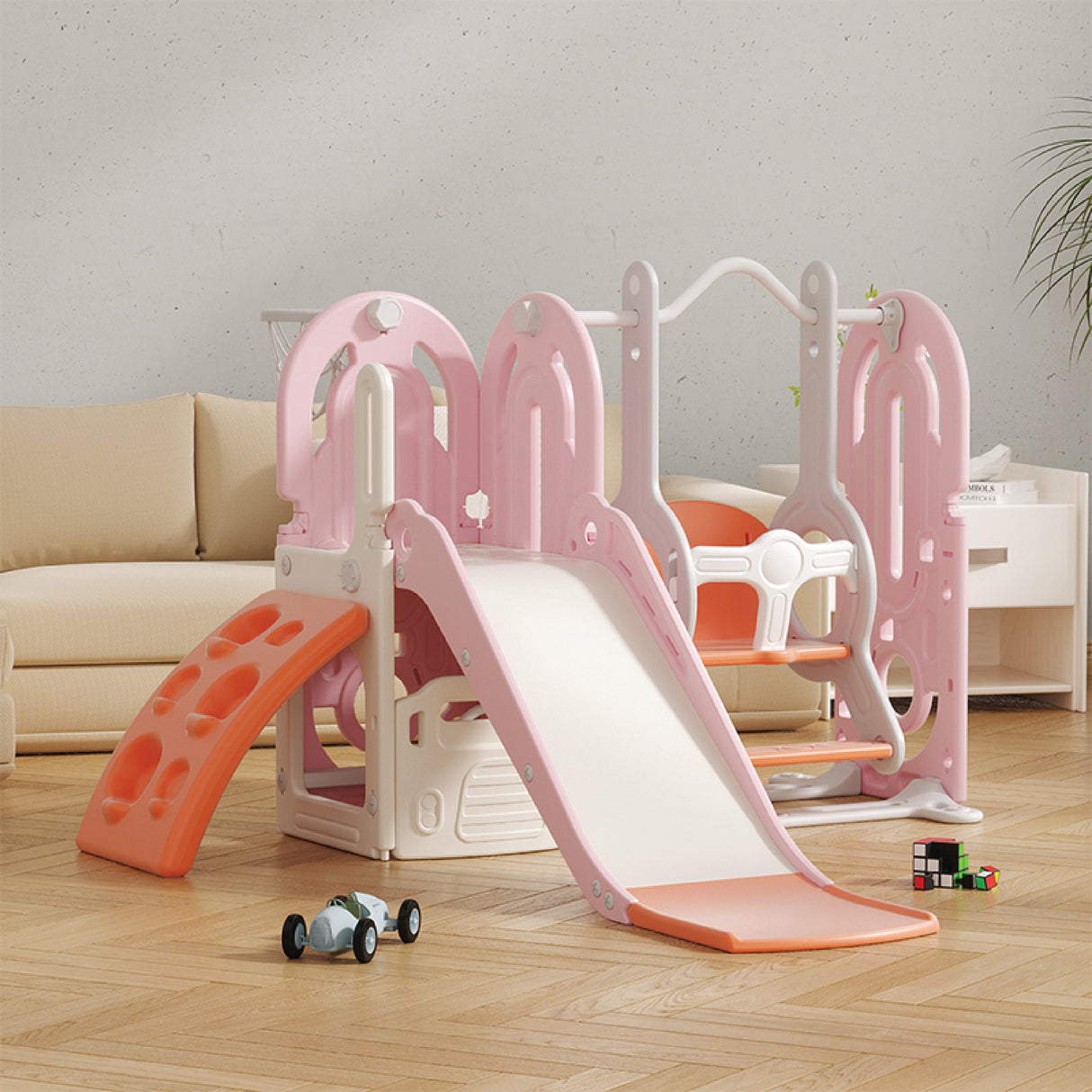 Children's playset with slide and swing on a wooden floor.