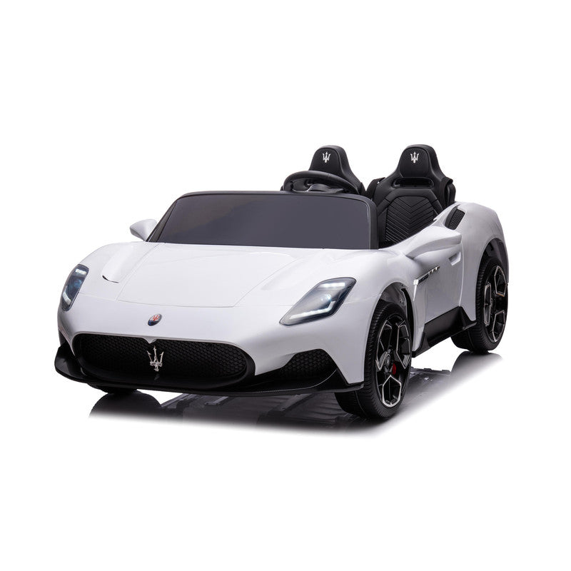 A white Maserati MC20 kids electric ride-on car with black wheels and interior, featuring realistic vehicle details and a brand logo.
