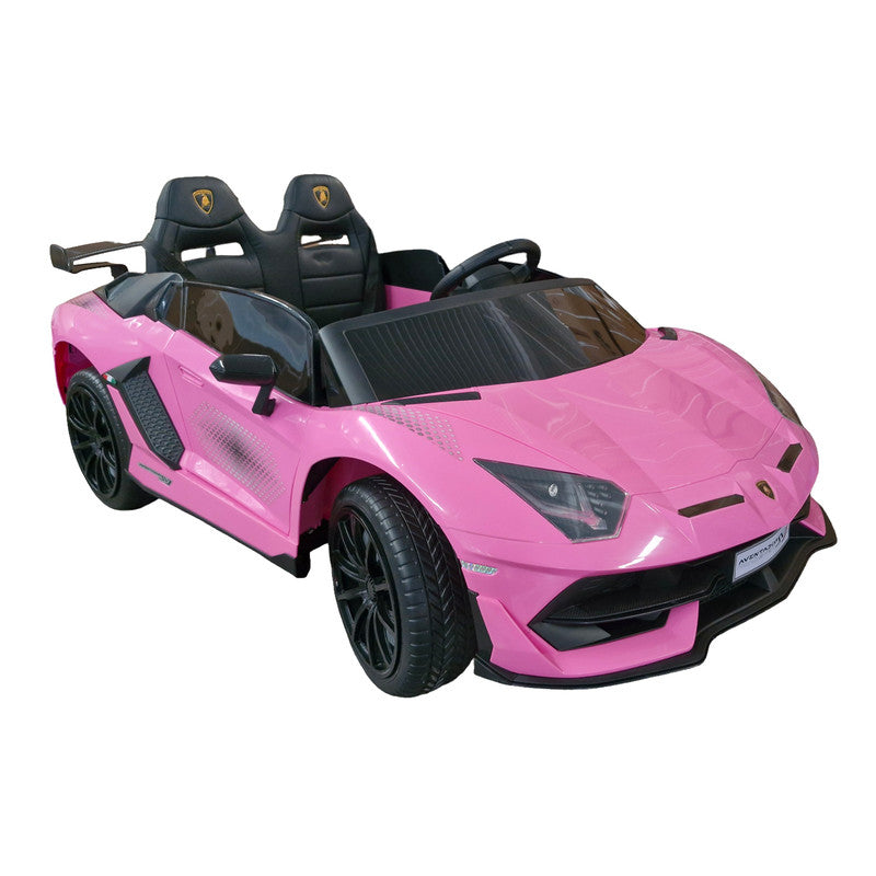 A pink Lamborghini Aventador SVJ kids ride-on car with scissor doors, LED lights, and dual leather seating.