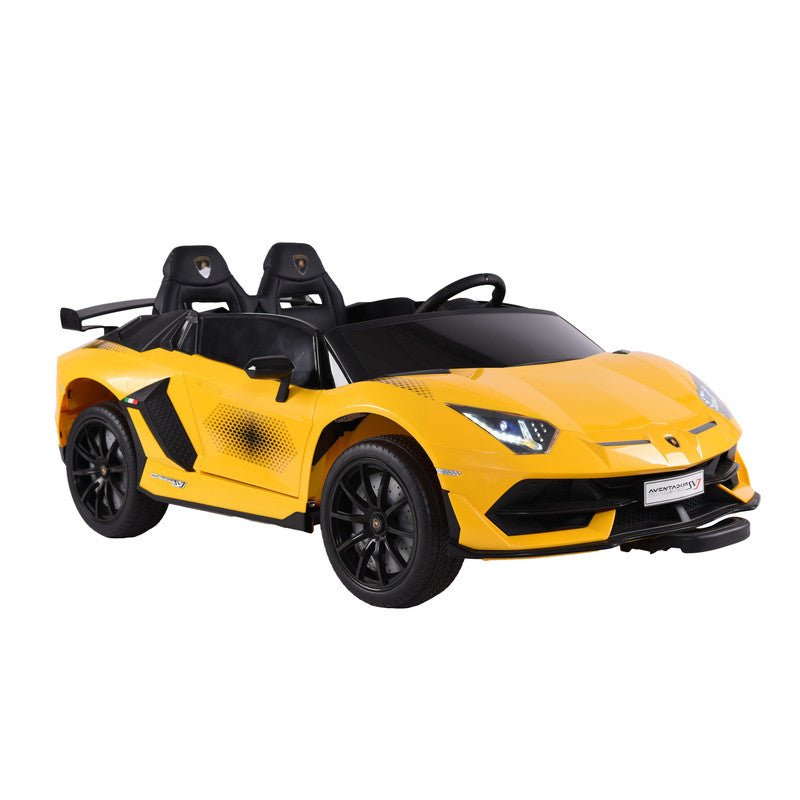 A yellow Lamborghini Aventador SVJ kids ride-on car with scissor doors, LED lights, and dual leather seating.