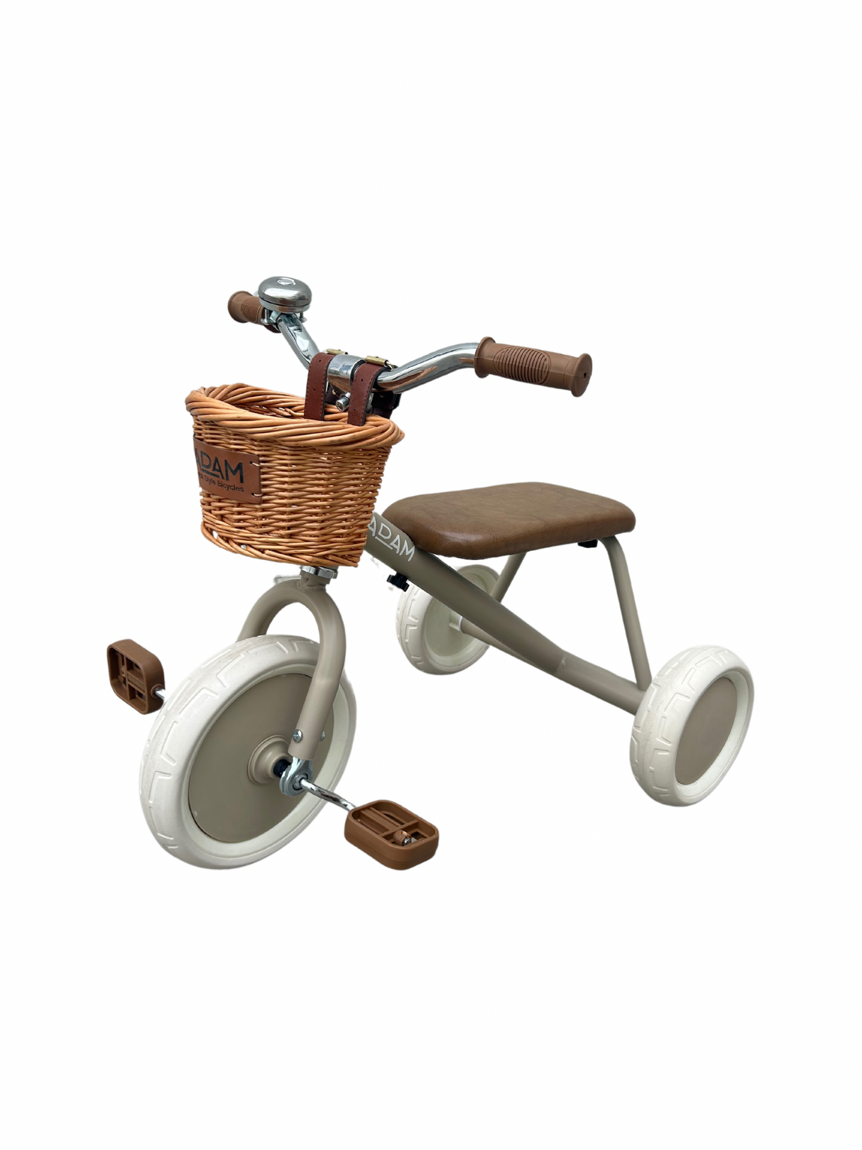 Children's tricycle with a brown seat and wicker basket on a white background