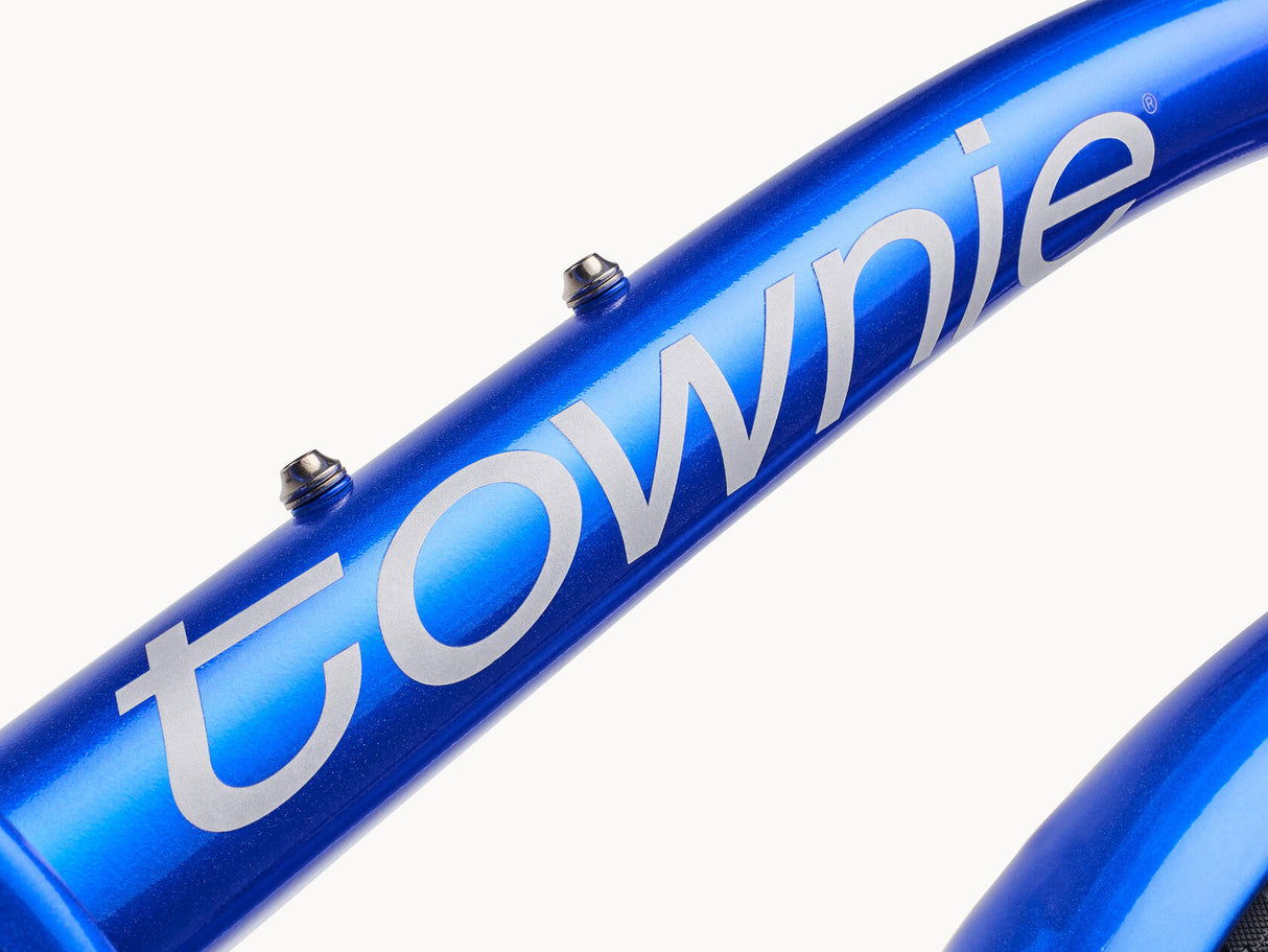 Blue bicycle frame with 'townie' branding on a white background