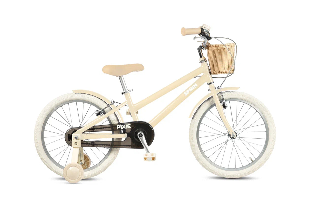 Beige children's bike with a basket on a white background