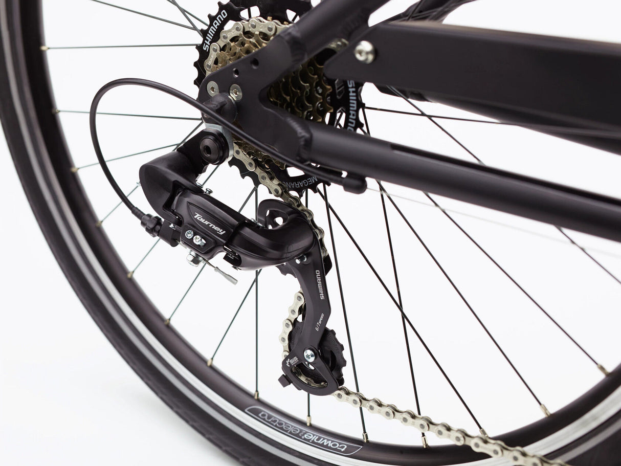Close-up of a bicycle's rear wheel and gear system on a white background