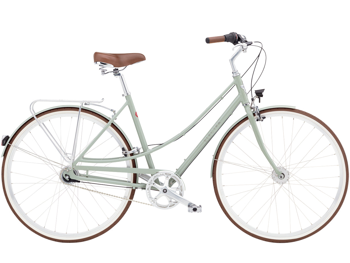 Light green bicycle with brown seat and tires on a white background