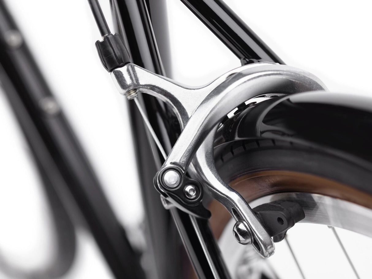 Close-up of a bicycle brake lever on a blurred background