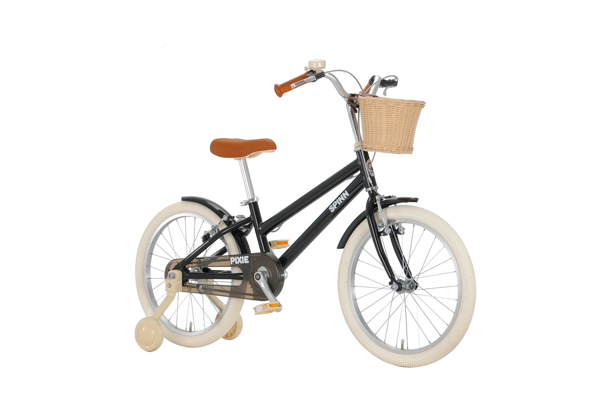 Black children's bike with a basket on a white background