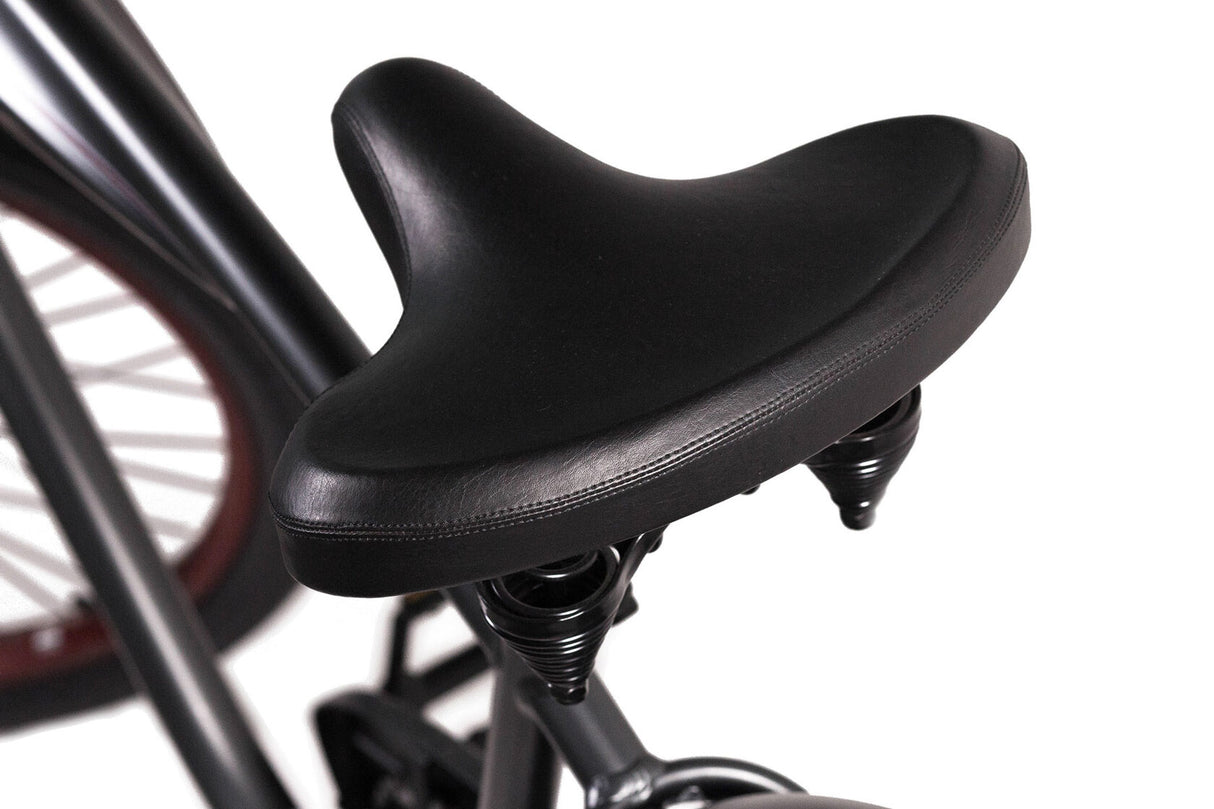 Close-up of a black bicycle seat on a white background