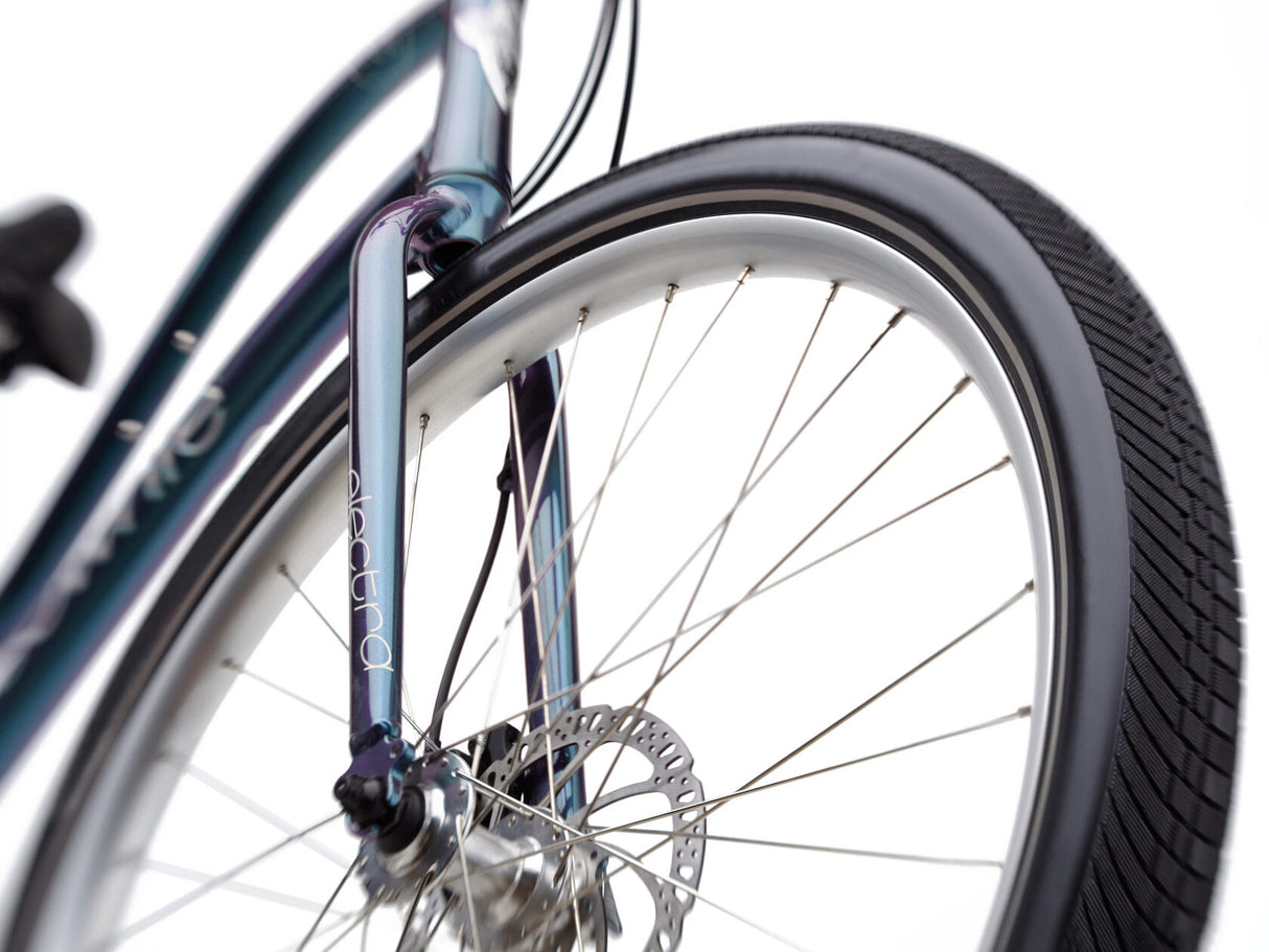 Close-up of a bicycle wheel with a white background