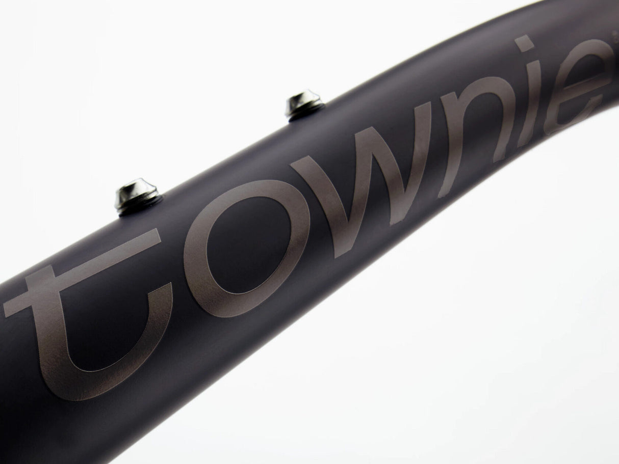 Close-up of a black bicycle rim with 'Townie' branding on a white background
