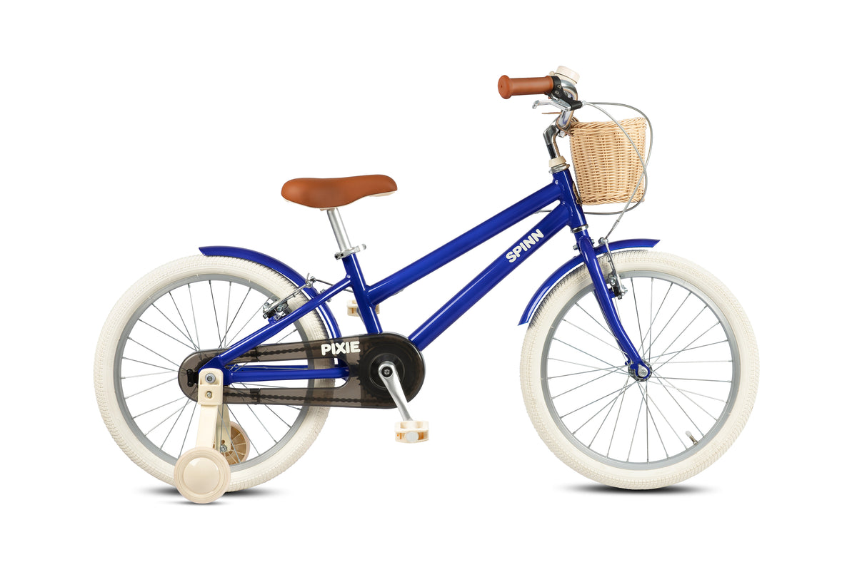 Blue children's bike with a basket on a white background