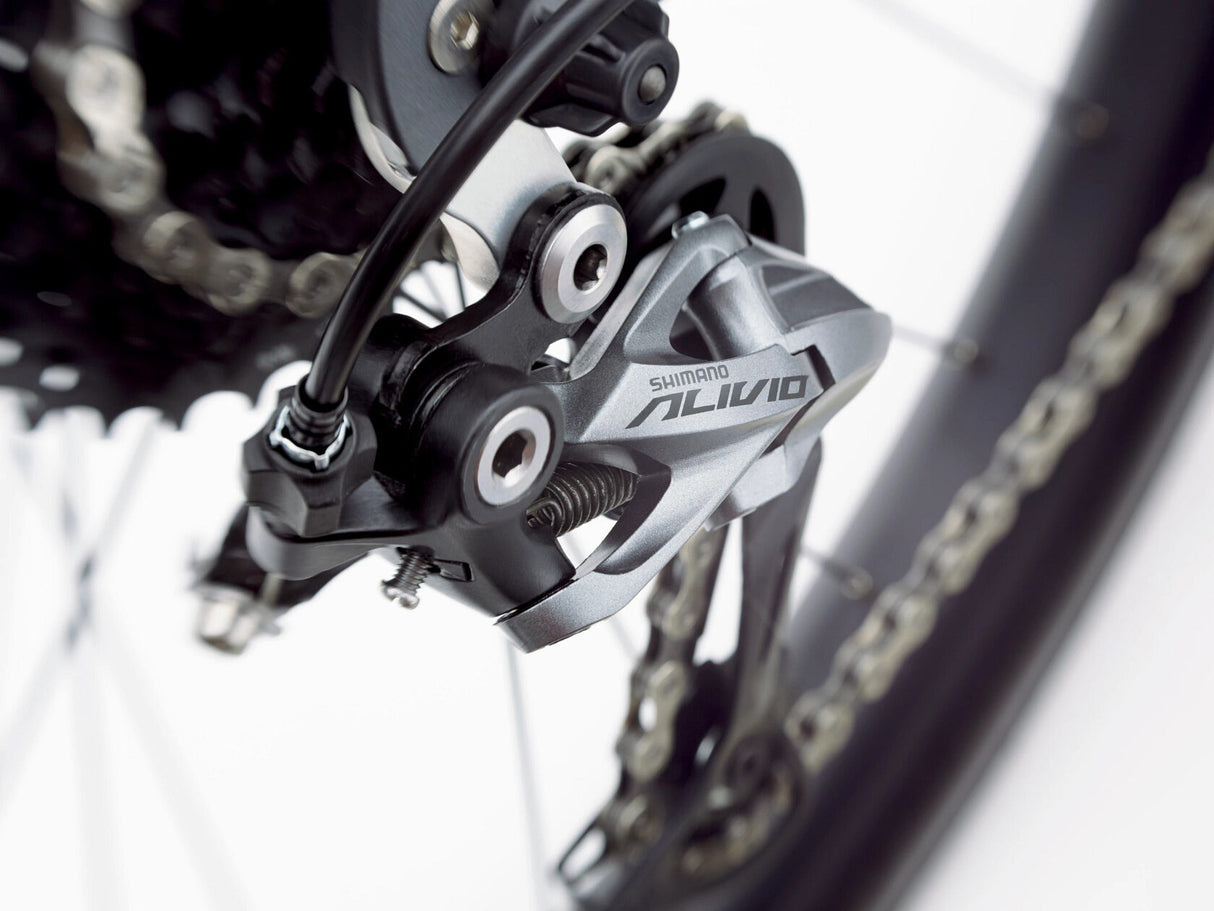 Close-up of a Shimano Alivio gear system on a bicycle.