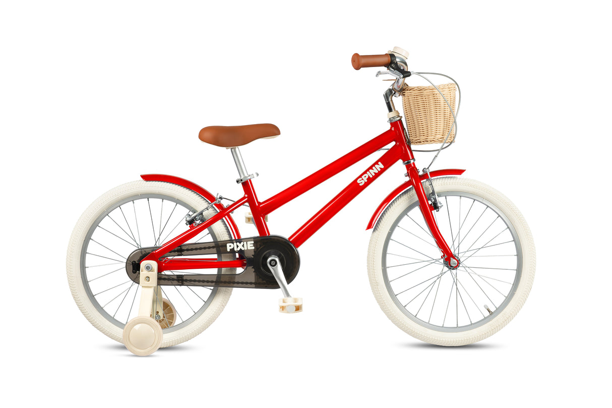 Red children's bicycle with a basket on a white background