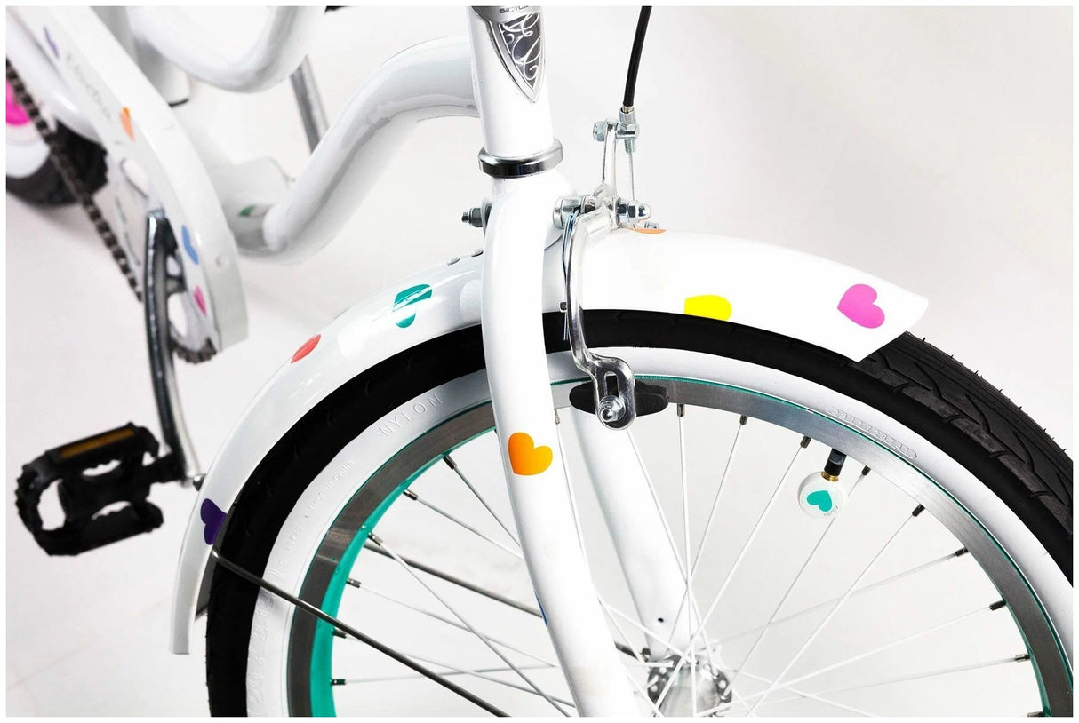 White bicycle with colorful stickers on a white background