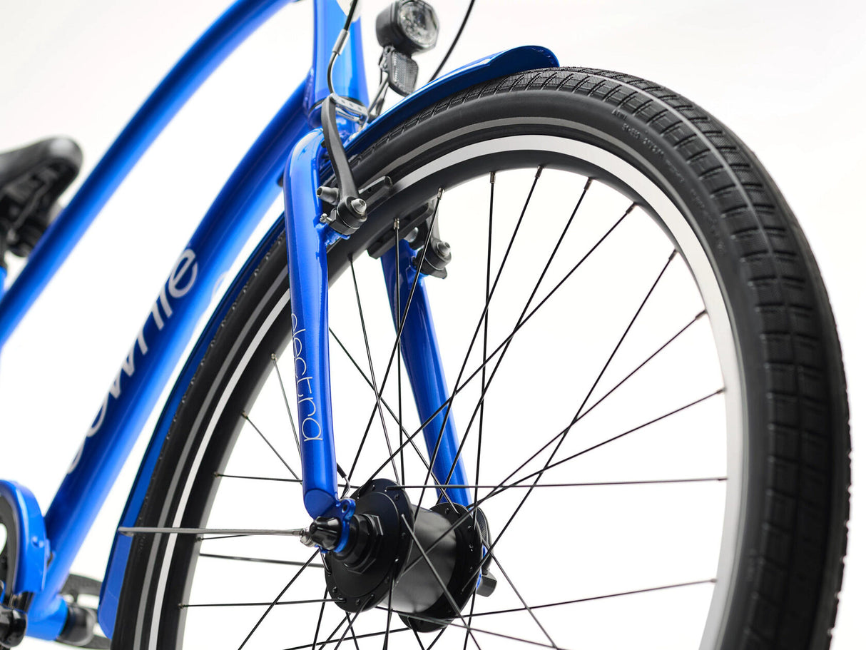 Close-up of a blue bicycle wheel with visible brand name on a white background