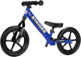 Blue Strider balance bike on a white background