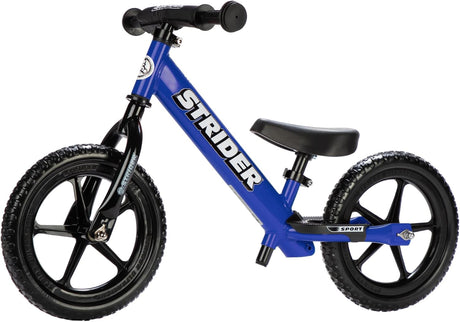 Blue Strider balance bike on a white background