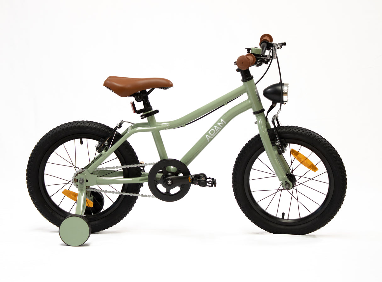 Children's mountain bike with a green frame and brown seat on a white background