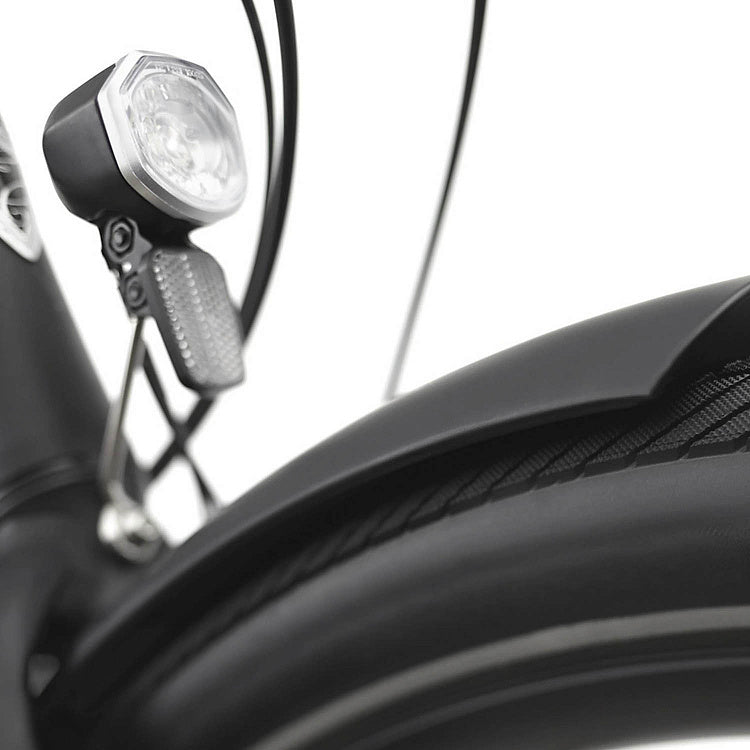 Close-up of a bicycle headlight on a white background