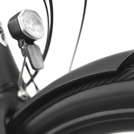 Close-up of a bicycle headlight on a white background