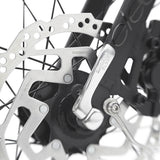 Close-up of a bicycle disc brake system with Shimano branding.