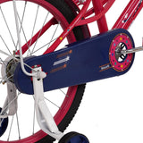 Close-up of a bicycle chain guard with decorative elements on a white background