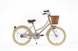 Beige bicycle with a brown basket on a white background