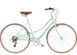Mint green bicycle with brown wheels and seat on a white background